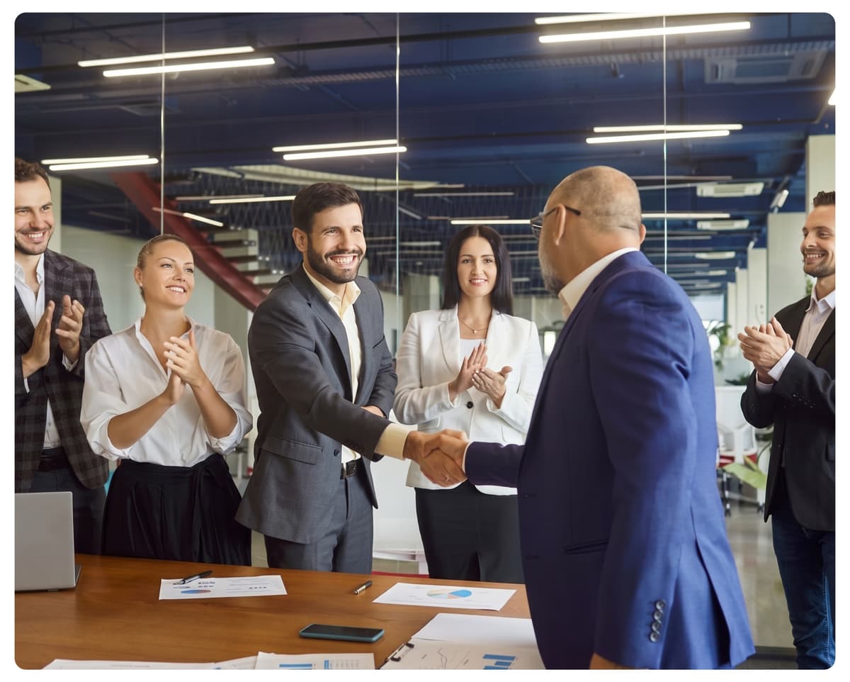 Professional team shaking hands in office